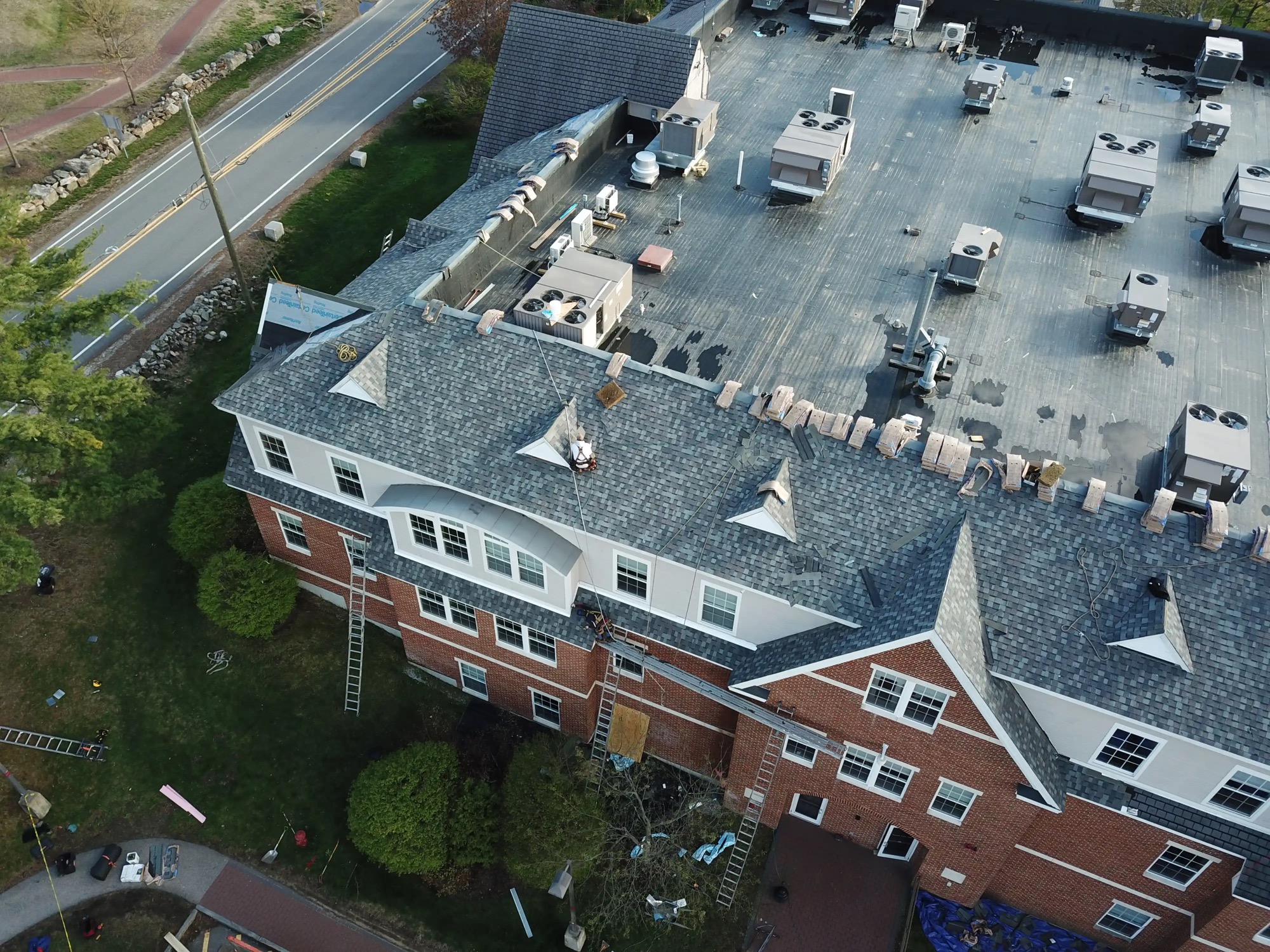 Commercial roof maintenance on a New Hampshire building