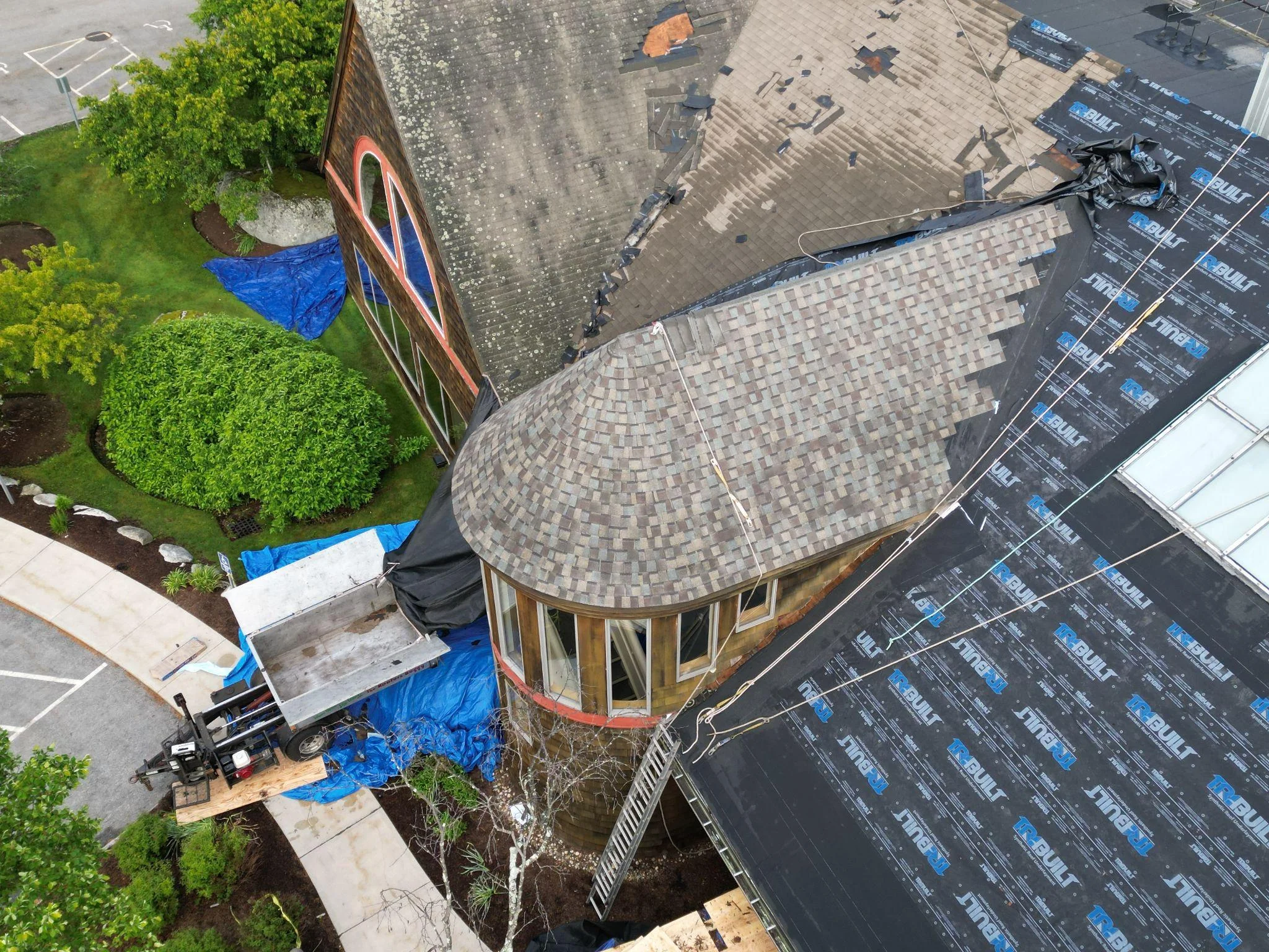 Roof tear-off during Exeter NH commercial roof replacement by Northpoint Roofing