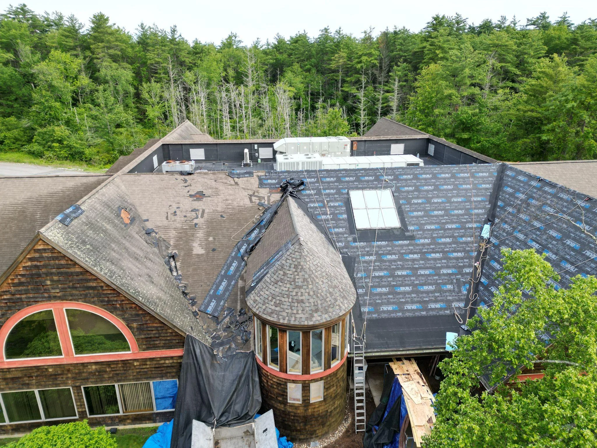 Damaged roof sheathing exposed during Exeter NH commercial roof replacement